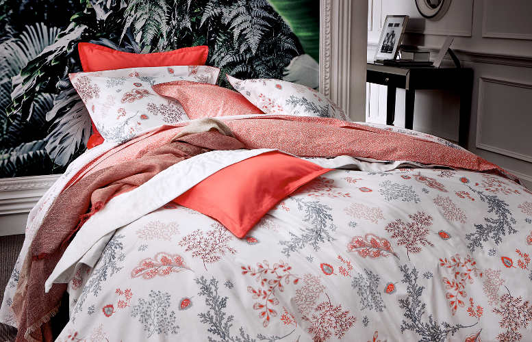 Alexandre Turpault Cristobal percale bedding features printed coral garden background with micro coral sateen ribbon piping.