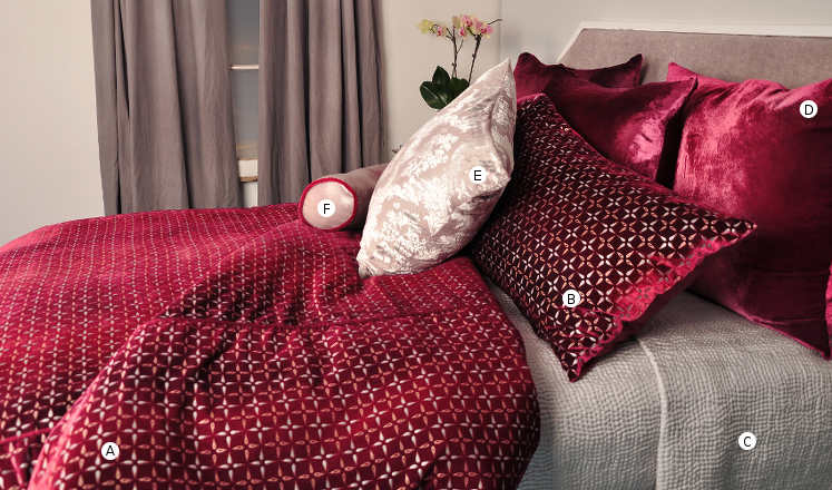 Kevin O'Brien Studio Metallic Petals Bedding includes a duvet, pillow shams, and decorative pillows.