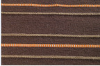Hand woven rug in pure new wool with felt details.