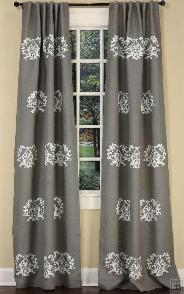 This decorated drapery has beautiful medallions strategically placed to create an incredible atmospheric room setting.
