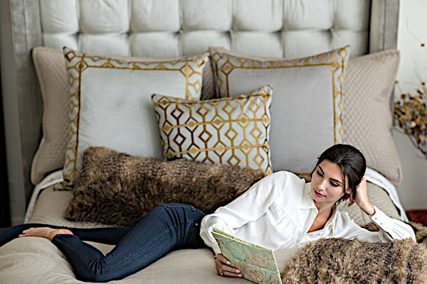 Lili Alessandra Chestnut Faux Throw and Decorative Pillows with model.