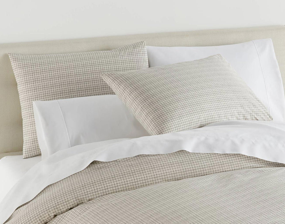 Classic and distinguished by design, a traditional menswear pattern is translated to the bedroom with Peacock Alley's Houndstooth Bedding