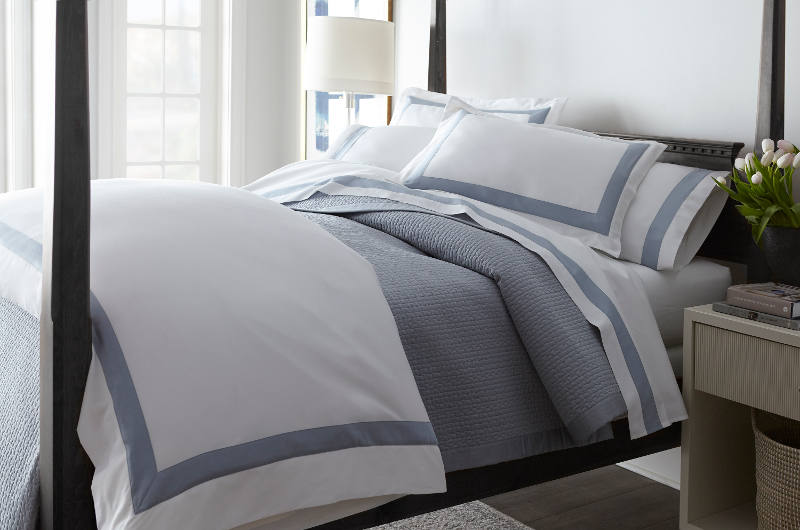 The bedding is appliqued with flat mitered corners, creating a handsome and luxurious design.